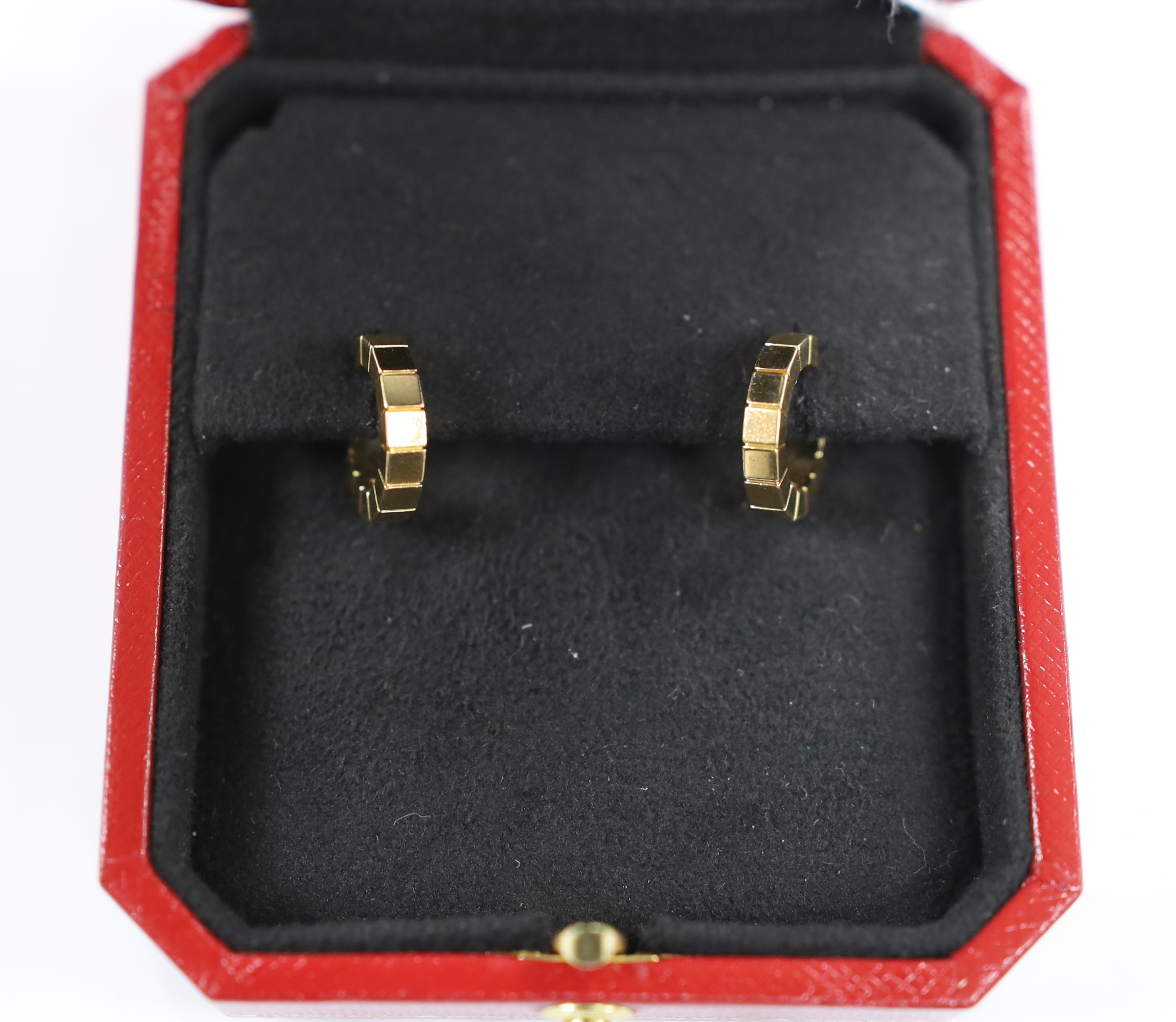 A modern pair of 750 Cartier hoop earrings, signed and numbered FK7259, 14mm, 7.1 grams, with Cartier box.